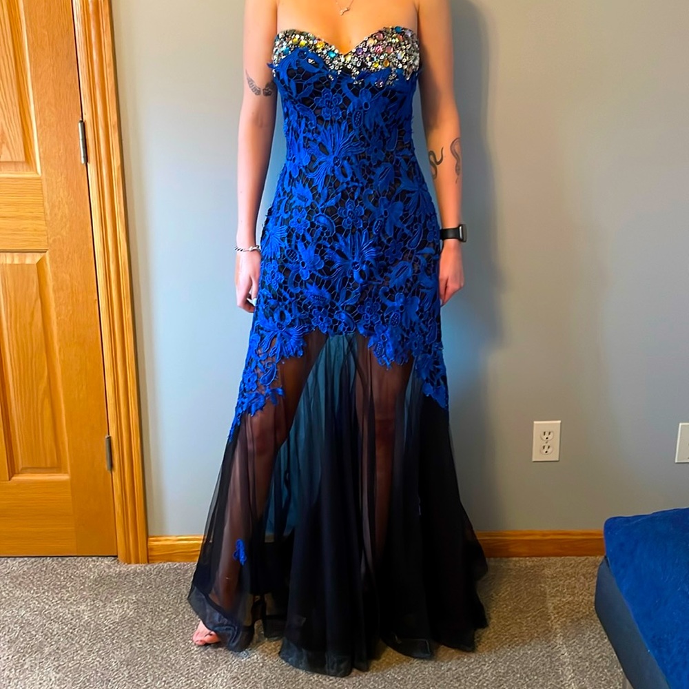 One of a kind dress.  Hand beading and flowers on bottom